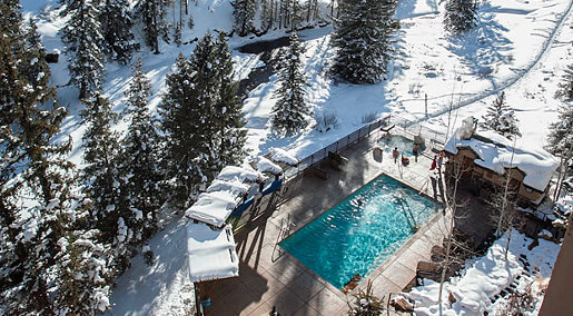 Mountain resort pool in snow: Travel Public Relations