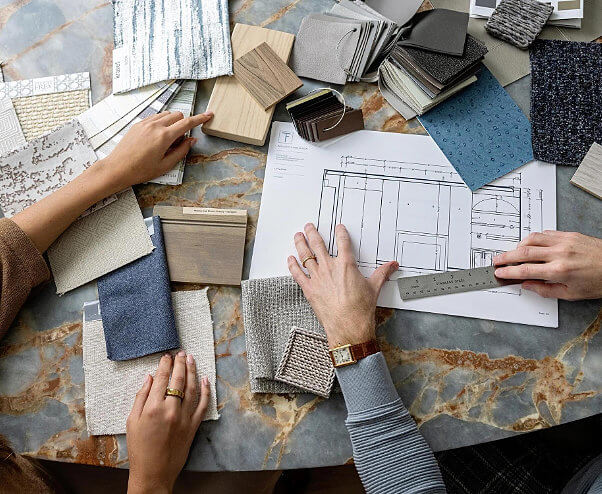 PR for interior designers - Overhead view of two people working on an interior design project